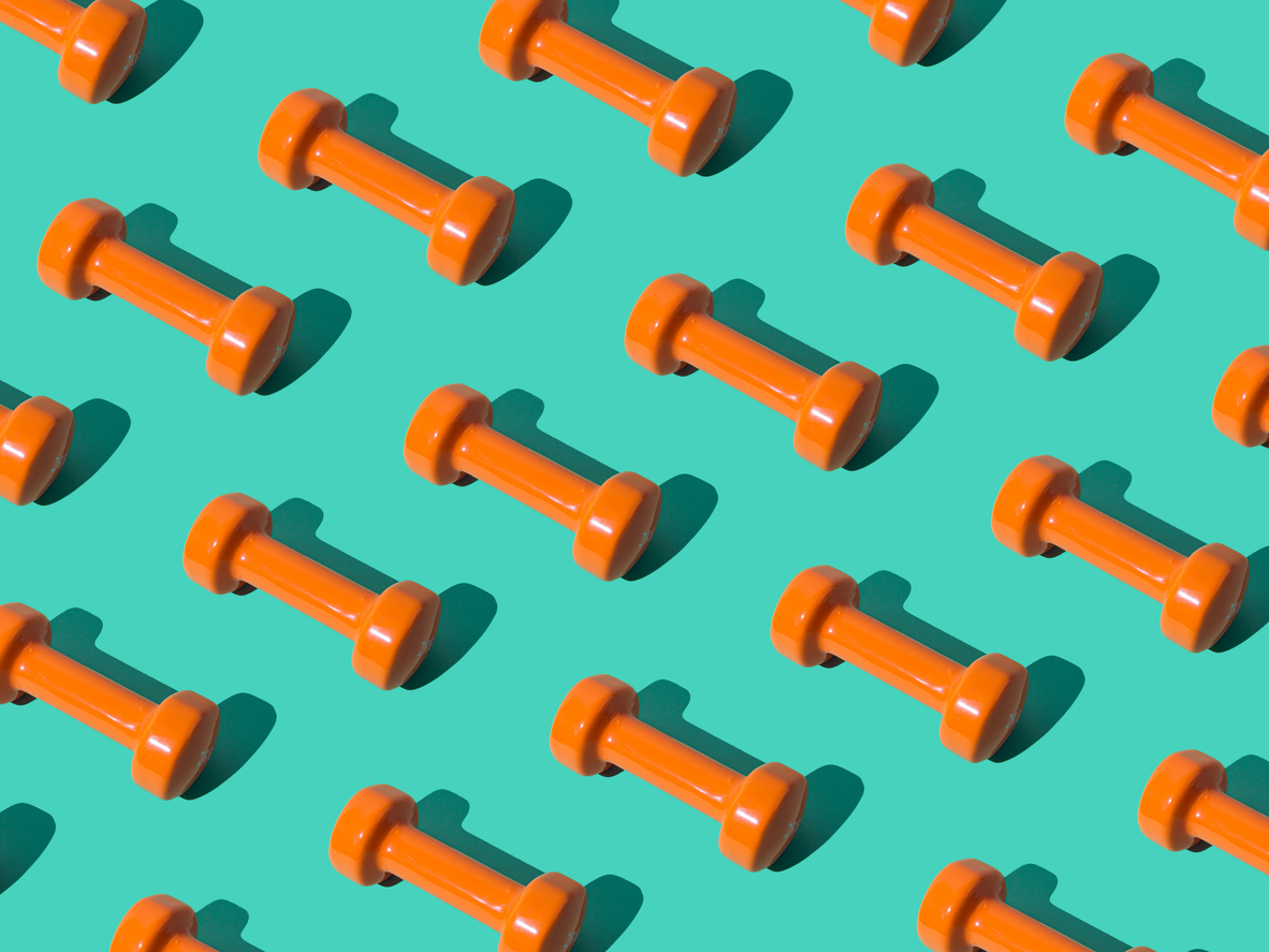 orange dumbells on an aqua background