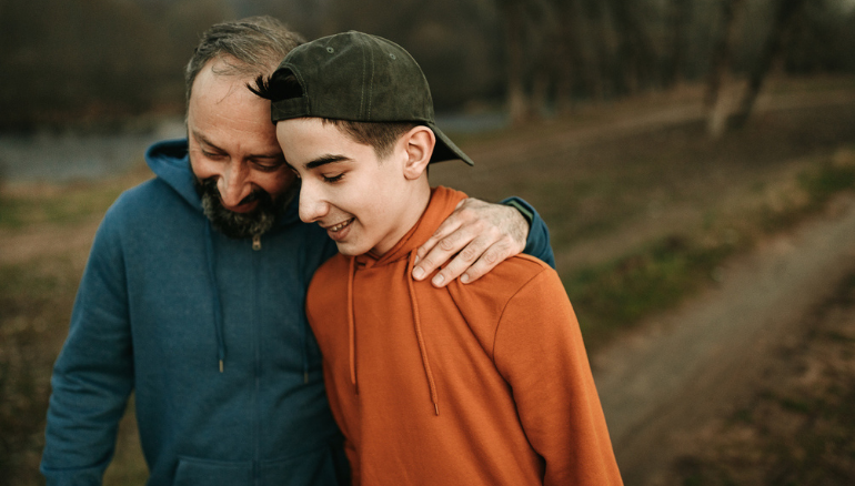 dad hugs son