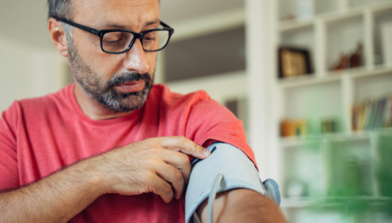 older man measuring blood pressure