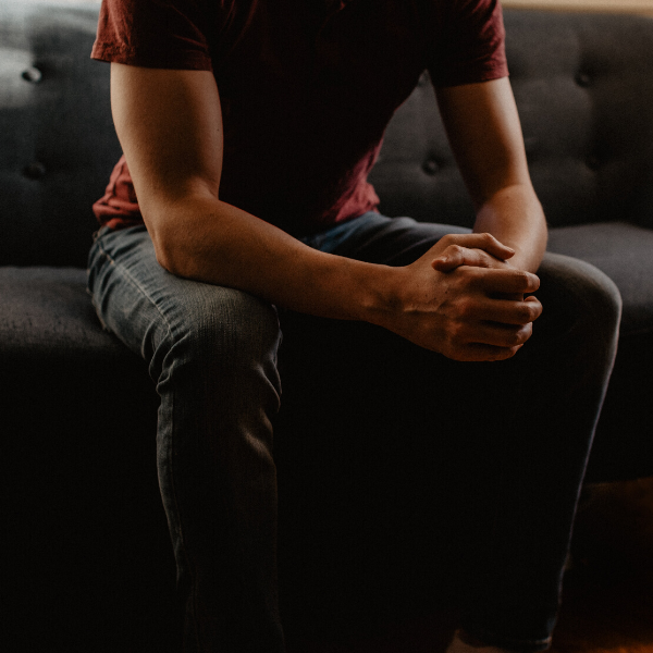 man-sitting-on-couch 